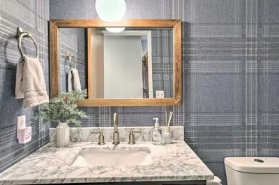 a bathroom with a sink and a mirror at Luxe Lake Arrowhead Getaway with Treetop Views! in Lake Arrowhead