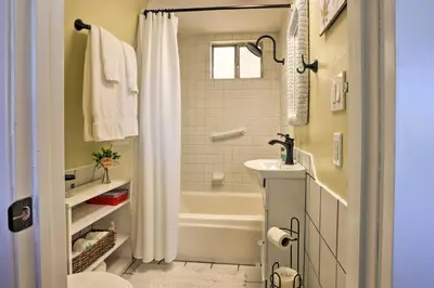 a bathroom with a tub and a toilet and a sink at Lake Arrowhead Studio Near Hiking with Hot Tub in Lake Arrowhead