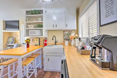 a kitchen with white cabinets and a counter top at Lake Arrowhead Studio Near Hiking with Hot Tub in Lake Arrowhead