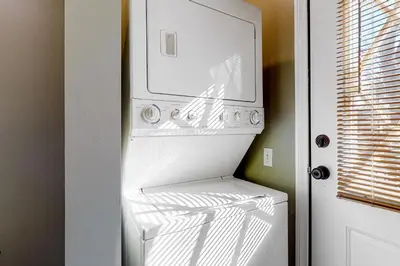 a white refrigerator with its door open in a kitchen at Running Springs R-n-R in Running Springs