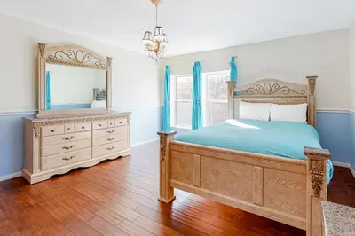 a bedroom with a bed and a dresser and a mirror at Running Springs R-n-R in Running Springs