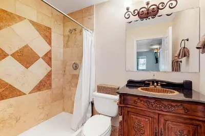 a bathroom with a toilet and a sink and a shower at Running Springs R-n-R in Running Springs