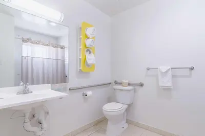a white bathroom with a sink and a toilet at Motel 6-Barstow, CA - Route 66 in Barstow