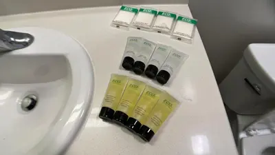 a bathroom counter with a sink and a white sink at ViewPoint Suites in Los Angeles