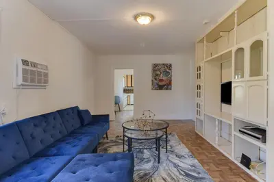 a living room with a blue couch and a table at Los Angeles 3 Bedroom Charmer Large Guest House in Los Angeles