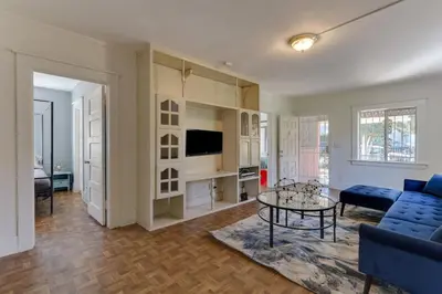 a living room with a couch and a table at Los Angeles 3 Bedroom Charmer Large Guest House in Los Angeles