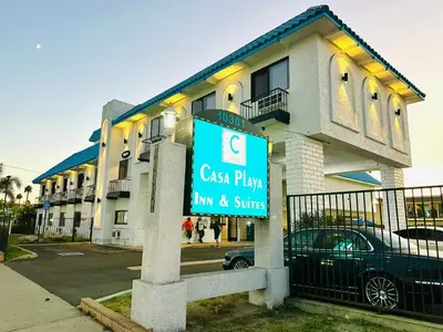 a sign in front of a apartment building at Casa Playa Inn - Stanton, Anaheim in Stanton