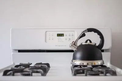 a tea kettle sitting on top of a stove at Modern LA Home Near Museums, Dining & Downtown in Los Angeles