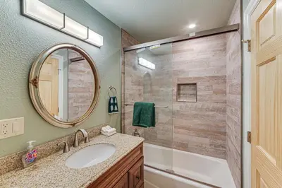 a bathroom with a sink and a mirror at Cozy Pine Mountain Club Cabin with Large Deck in Pine Mountain Club
