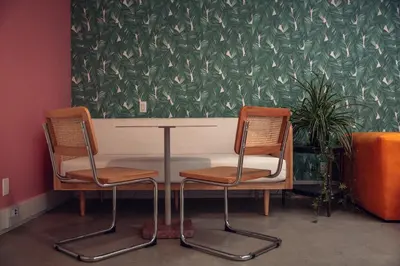 two chairs sitting next to a table in a room at STAY OPEN Venice Beach in Los Angeles