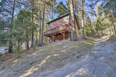 a house on a hill in the woods at Cozy Cabin about 3 Mi to Lake Arrowhead Village! in Lake Arrowhead
