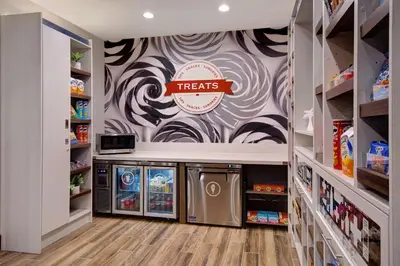 a grocery store aisle with aries sign on the wall at Hampton Inn & Suites By Hilton Rancho Cucamonga in Rancho Cucamonga