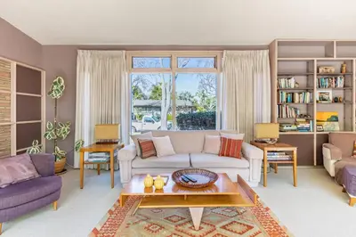 a living room with a couch and a table at Bixby Beauty 50s Mod Long Beach in Long Beach