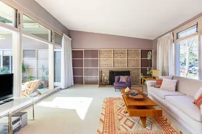 a living room with a couch and a table at Bixby Beauty 50s Mod Long Beach in Long Beach