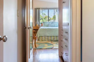 a bedroom with a bed and a window at Bixby Beauty 50s Mod Long Beach in Long Beach
