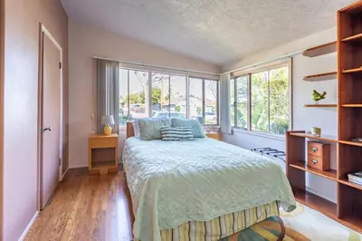 a bedroom with a bed and a window at Bixby Beauty 50s Mod Long Beach in Long Beach