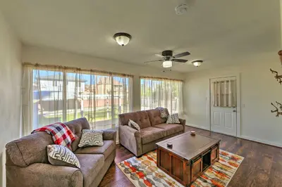 a living room with two couches and a coffee table at Riverside House with Yard about 1 Mi to Downtown! in Riverside