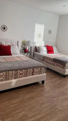 two beds sitting next to each other in a room at Incredible Hollywood Loft Free Parking in Los Angeles