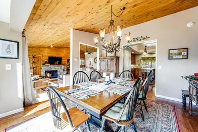 a dining room with a table and chairs at Gregory Getaway in Crestline