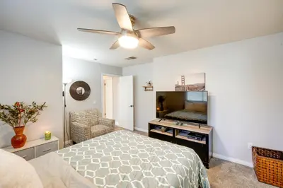 a bedroom with a bed and a ceiling fan at Private Pool and Patio Pet-Friendly Bakersfield Gem in Bakersfield