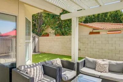 a patio with two chairs and a couch on a porch at Private Pool and Patio Pet-Friendly Bakersfield Gem in Bakersfield