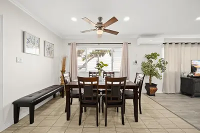 a dining room with a table and chairs and a ceiling fan at Dreamy & Relaxing Gem With Backyard - 12mins to DT LA in Alhambra