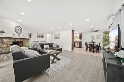 a living room with a couch and a fireplace at Dreamy & Relaxing Gem With Backyard - 12mins to DT LA in Alhambra