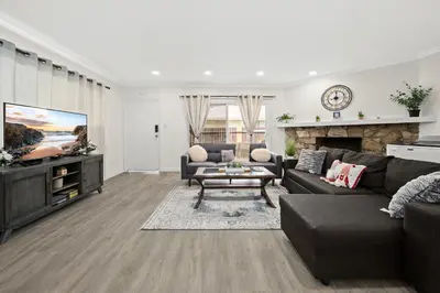 a living room with a couch and a tv at Dreamy & Relaxing Gem With Backyard - 12mins to DT LA in Alhambra