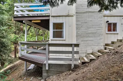 a house with a staircase next to a building at Lake house Cabin - Lake Arrowhead in Lake Arrowhead