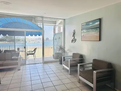 a living room with a view of the ocean at Foghorn Harbor Inn in Los Angeles