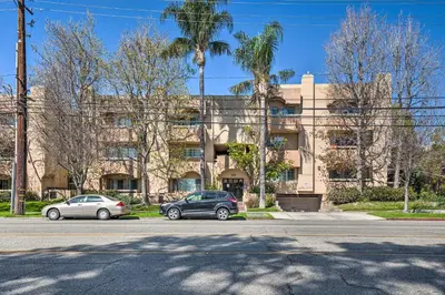 two cars parked in front of a building at 2 Mi to Griffith Park! Burbank Extended-Stay Condo in Burbank