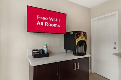 a sign that reads free wifi all rooms on a wall at Red Roof Inn Carson - Wilmington, CA in Wilmington
