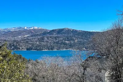 a view of a lake with mountains in the background at Stunning Lake Arrowhead Cabin with Lake Views! in Lake Arrowhead