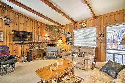 a living room with a couch and a table at Kernville - walk to River Kern & Downtown in Kernville