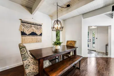 a dining room with a wooden table and chairs at Paradise in the Palisades in Lake Arrowhead