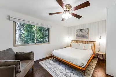 a bedroom with a bed and a ceiling fan at Paradise in the Palisades in Lake Arrowhead