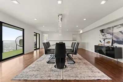 a dining room with a table and chairs at The Hollywood Hills Crest Villa in Los Angeles