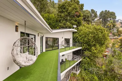 an aerial view of a house with a green lawn at The Hollywood Hills Crest Villa in Los Angeles