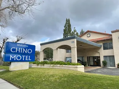 a chino motel sign in front of a building at Chino Motel in Chino