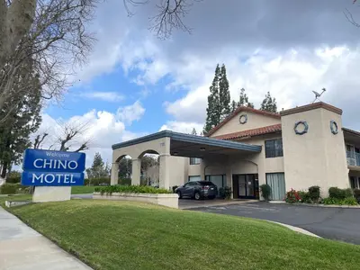 a chino motel sign in front of a building at Chino Motel in Chino