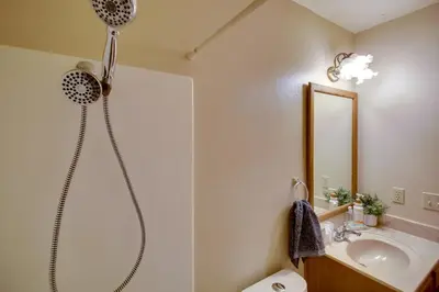 a bathroom with a shower and a sink at Peaceful and Idyllic Forest Cabin with Pool Table in Pine Mountain Club