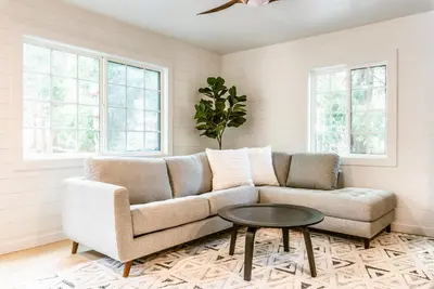 a living room with a couch and a table at The Kingsley Hotel in Lake Arrowhead