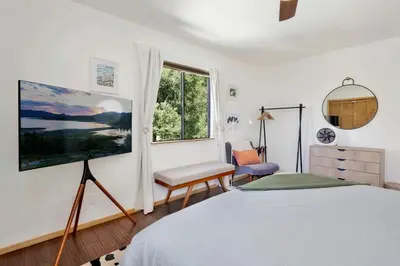 a bedroom with a bed and a window at Chimney Peak Chalet #2048 by Big Bear Vacations in Big Bear City