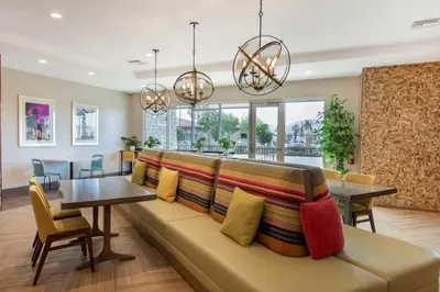 a living room with a couch and a table at Home2 Suites By Hilton Redlands in Redlands