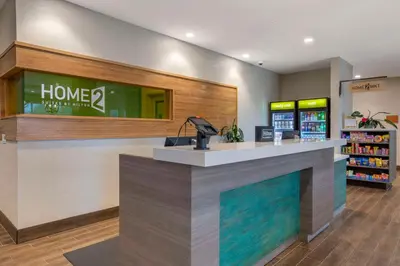 a lobby of a home store with a fireplace at Home2 Suites By Hilton Redlands in Redlands