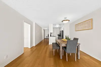 a dining room and living room with a table and chairs at The tulip Marina Highrise with ocean view in Los Angeles