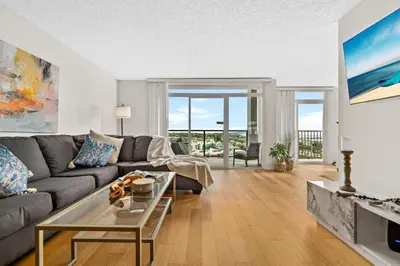 a living room with a couch and a table at The tulip Marina Highrise with ocean view in Los Angeles