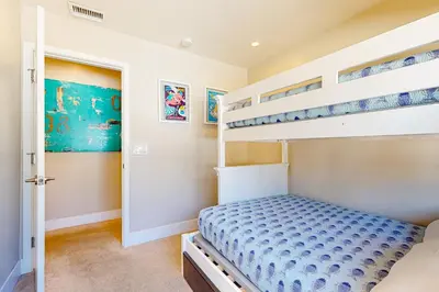 a bedroom with bunk beds in a house at Castles Reach in Anaheim