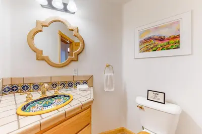 a bathroom with a sink and a mirror at Million Dollar Mountain View in Crestline
