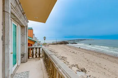 a view of the beach from the balcony of a house at Breakers Way Dream in Carpinteria